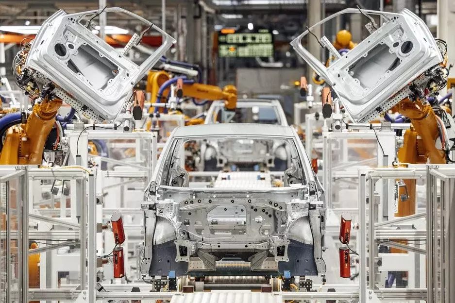 Volkswagen Sachsen, Türeneinbau per Roboter Volkswagen Sachsen, Türeneinbau per Roboter (Quelle: Volkswagen)